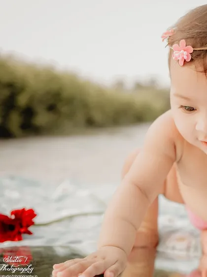 A close-up from the same outdoor birthday session, focusing on her delicate features and the flower crown she wore. These detailed shots add so much texture to the final gallery.