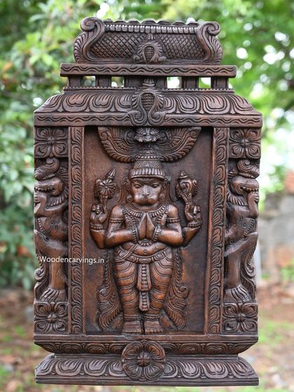 The full Hanuman Kavadi, showing the intricate frame and side figures that complete the portable shrine.