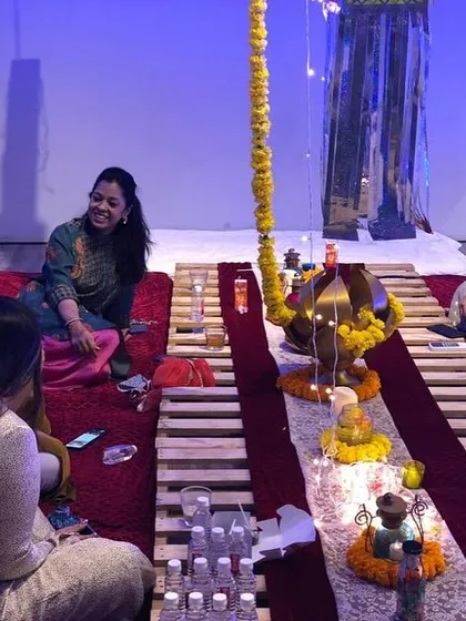 Guests enjoying an intimate Diwali gathering with our beautiful low-seating setup, perfect for conversations and card games.
