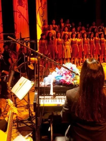 From the wings of a concert we managed, this view shows the full orchestra and choir on stage. We handle all technical aspects so the performers can focus on their art.