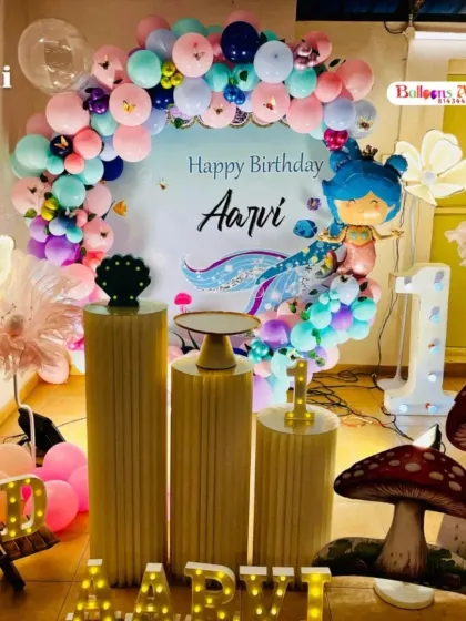 Another angle of Aarvi's mermaid party, this time showing the whimsical mushroom props and additional lighting that add to the magical atmosphere.