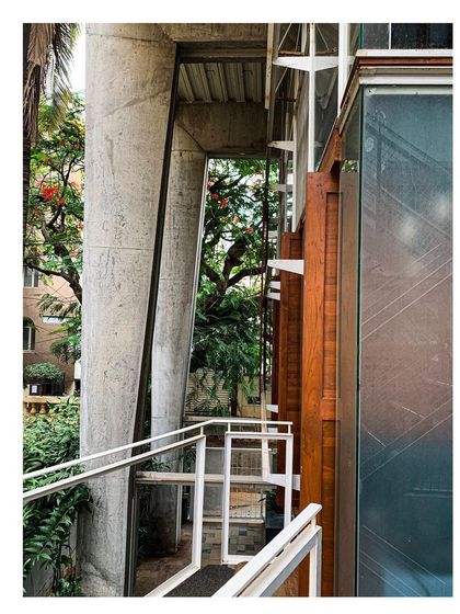 A close-up of the tapered concrete portals, which are left in their raw, form-finished state to express the craftsmanship of their construction. Despite their large scale, subtle changes in the cross-section make them appear elegant and lightweight.