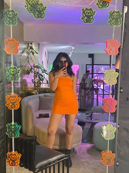 Another mirror selfie from the 'Cyberfantasy' shoot. The orange dress and cool location really fit the vibe of the song.
