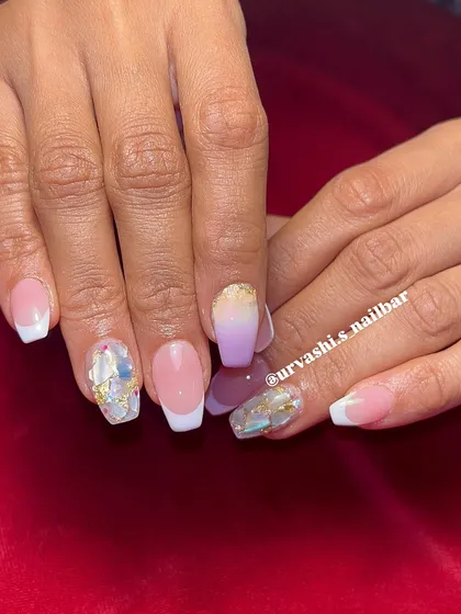 This set combines multiple techniques for a unique bridal look. It features classic French tips alongside a purple ombré nail and accent nails with shattered glass and gold foil details.