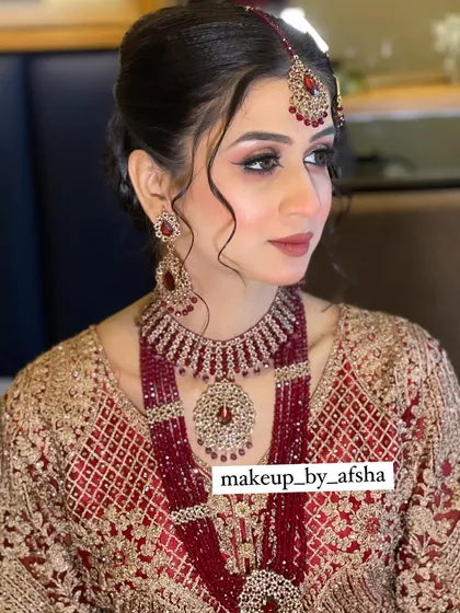 A beautiful portrait showing the intricate details of her jewellery and the soft, romantic hairstyle.