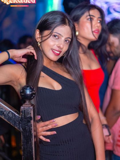 A guest posing on the stairs.