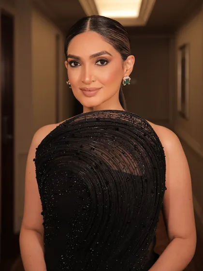 A close-up of the client, her makeup looking elegant and sophisticated.