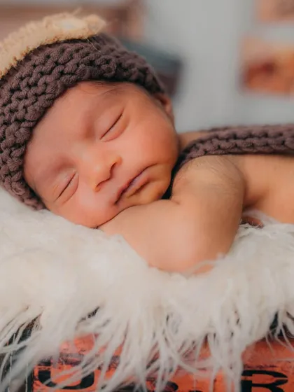 Every detail matters, especially the peaceful expressions of a sleeping baby. This is a classic newborn portrait that families will love for years to come.