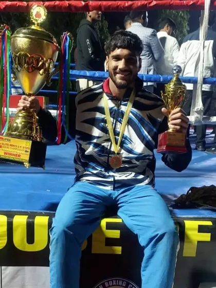 Another victory for the academy. Our boxer Ratandeep celebrates with his Gold medal and winner's trophy after conquering the UP Senior State Championship.