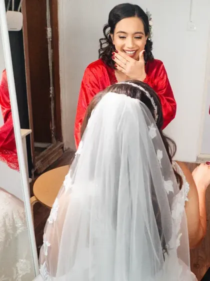 Laughter and tears of joy as the bridesmaids see their friend in her wedding dress.