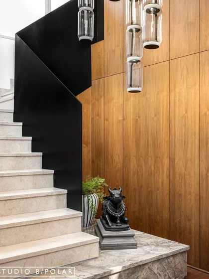 In the transitional spaces of Noor Haus, like hallways and lift lobbies, we used warm wood paneling, sculptural furniture, and curated art to turn these "in-between" zones into beautiful design moments.