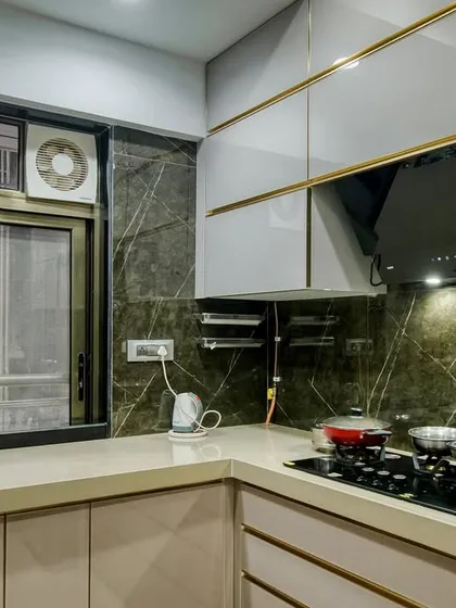Another view of the cooking area, showing the beautiful marble-patterned backsplash.