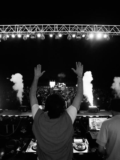 A black and white shot from the stage at IIM Indore, capturing the symmetry of the stage production.