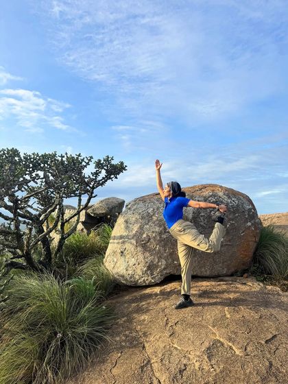 Finding my balance with Natarajasana during a trek to Uttari Betta. The hills around Bengaluru offer the most stunning backdrops for a yoga practice.