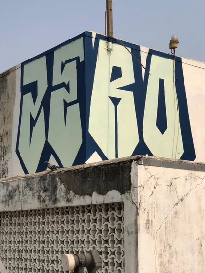 A clean, bold, large-scale 'ZERO' piece on a building rooftop in Mumbai. This shows the power of simple, well-executed letterforms to create a strong visual landmark. It's my name, writ large.