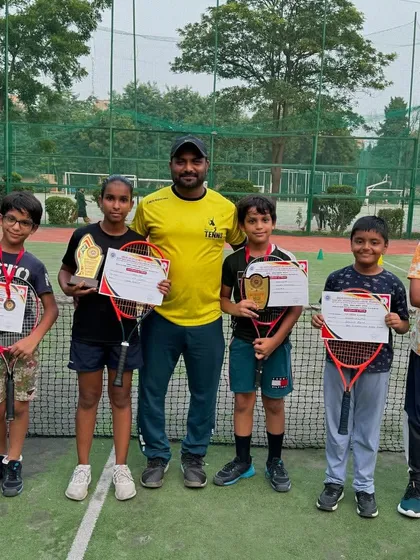 The result of dedication. Here I am with a group of our young champions after their success at the DDA Tennis Tournament. We celebrate every win because we know the hard work that goes into it.