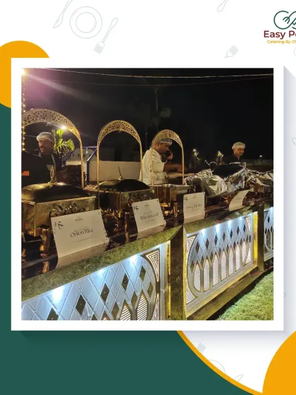 A close-up of our premium buffet counters at a night event. The combination of elegant lighting, professional staff, and delicious food creates a truly memorable experience.