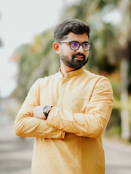 A handsome portrait of the groom in his yellow kurta, ready for the Haldi festivities.