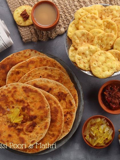 The perfect Sunday scene: crispy, homemade Mathri and Missi Poori served with spicy pickle and a hot cup of chai. These snacks are perfect for a relaxing afternoon.