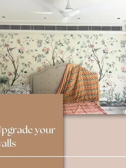 We believe in upgrading your walls to reflect your personal style. This bedroom showcases a beautiful floral mural, transforming the space into a serene garden and demonstrating how a wall covering can be the foundation of a room's aesthetic.
