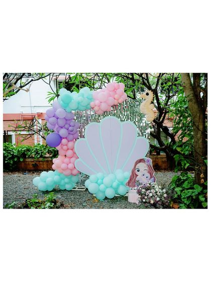 Another view of the beautiful seashell photo booth, perfect for capturing magical memories.