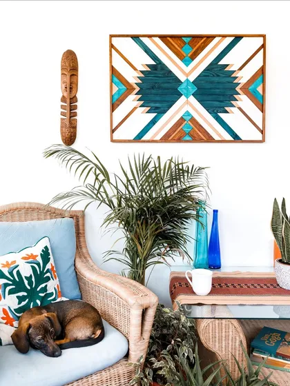 Our Geometric Blue Wood Art brings a vibrant, bohemian energy to this cozy corner. The Aztec-inspired patterns and rich teal and wood tones create a cheerful and stylish piece that perfectly suits eclectic and modern home decor.