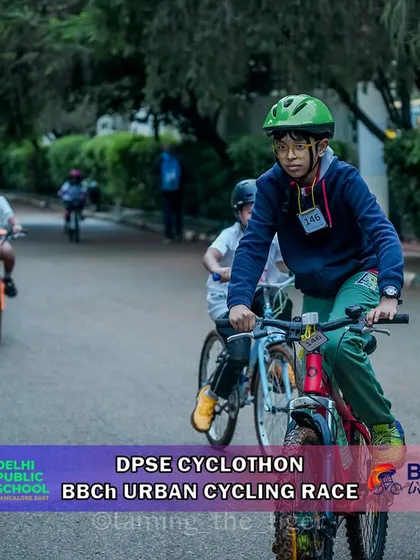 A young rider navigates a paved path during the urban cyclothon. Our courses often feature mixed terrain to provide a dynamic and fun challenge.