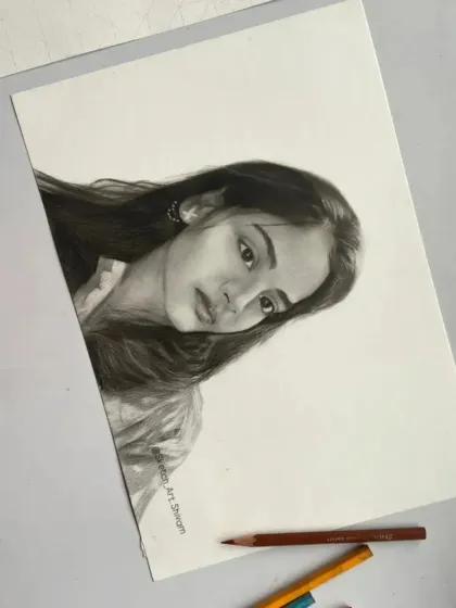 This A4 realistic sketch was an order from Lucknow. The final piece is laid out with some of my pencils to show the tools of the trade.