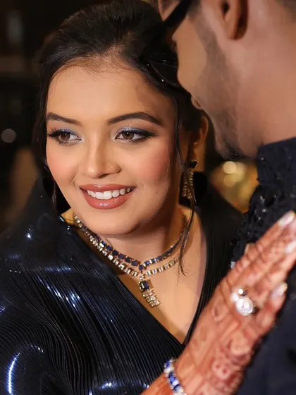 This is what a dreamy Sangeet night looks like. For this bride, I created a glamorous look with bold, sparkling eyes to match the celebratory mood, capturing a beautiful, candid moment with her partner.