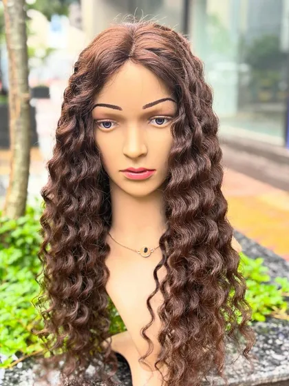 Our premium curly wig in dark brown offers amazing volume and length. It's comfortable for everyday use and glamorous enough for special occasions.