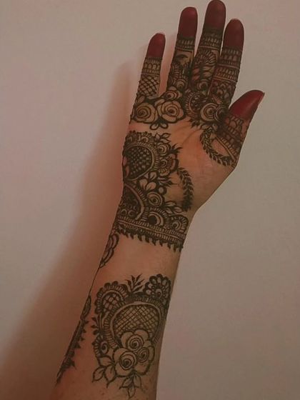 A full view of the arm, showcasing the complete stained bridal design. The color is consistent and deep, a result of my organic henna and proper aftercare.