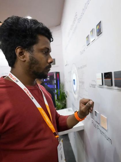 A visitor gets a hands-on experience with our SyncPro keypads, testing out the different models from our Plus and Plus Premium series on the display wall at our expo booth.