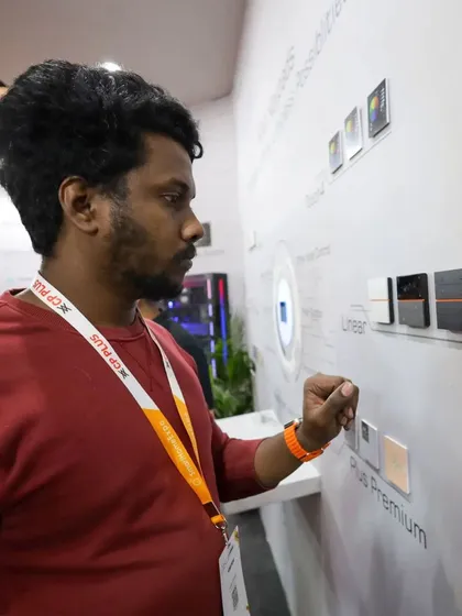 A visitor gets a hands-on experience with our SyncPro keypads, testing out the different models from our Plus and Plus Premium series on the display wall at our expo booth.
