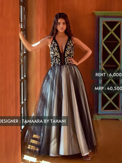 Make a statement at your next cocktail event with this black and white tulle gown by Tamaara by Tahani. Featuring a plunging neckline and an embellished bodice, it's available for just ₹6,000.
