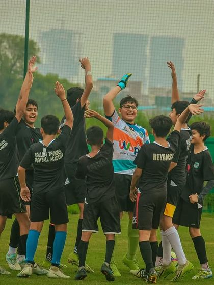 A team celebrates a goal together, a perfect example of teamwork and shared success.