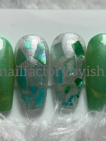 A green and silver press-on set with a shattered glass effect. We cover techniques like this in my advanced courses.