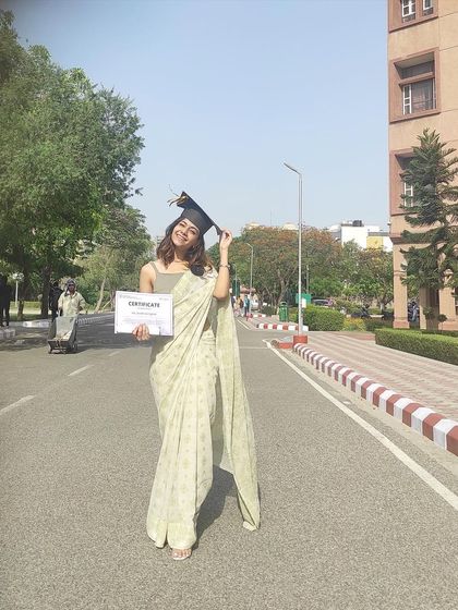 Another shot from my graduation day, holding my certificate with pride. This vintage saree was the perfect choice to mark such a special milestone.