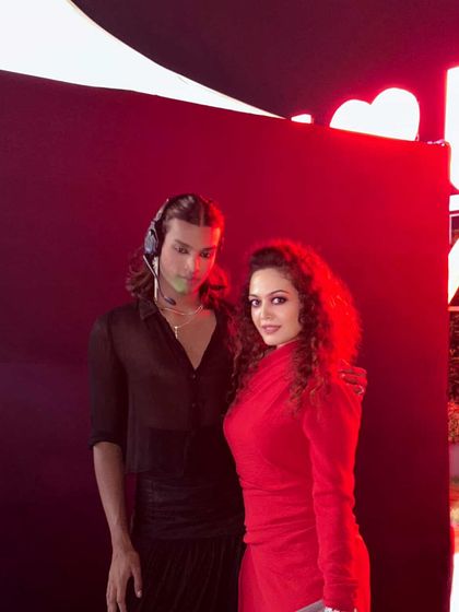 A moment with the show director before the fashion show. It takes a dedicated team to bring a vision to life on the ramp.