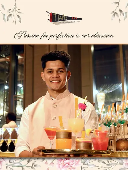 A bartender serves a tray of assorted colorful mocktails, offering guests a variety of refreshing choices.