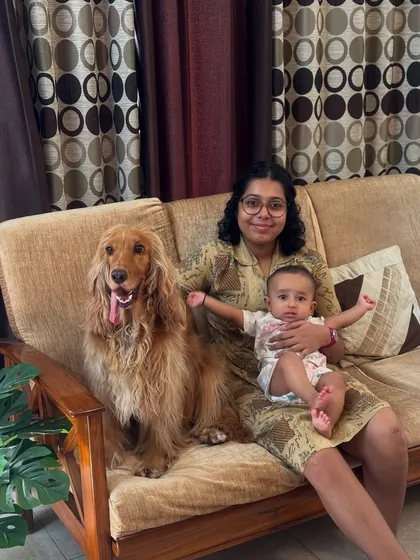 Cousins relaxing on the couch. Posto is always happy to share his space with the little ones.