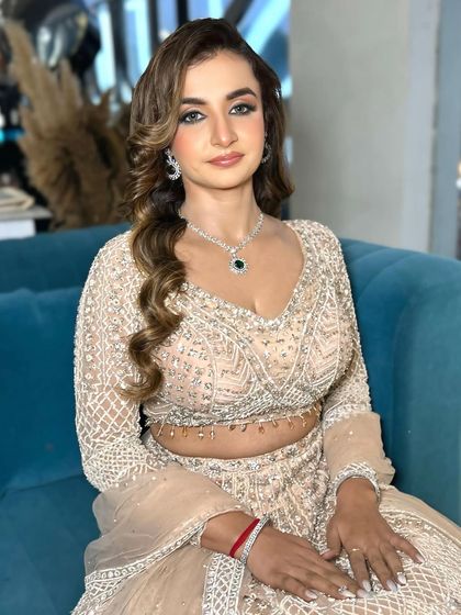 A straight-on shot showing the symmetry and balance of this engagement makeup look.