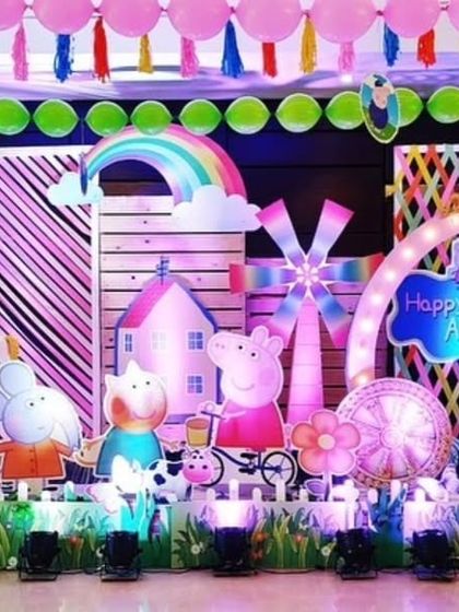 Another view of the vibrant Peppa Pig stage, showing the detailed props and bright lighting.