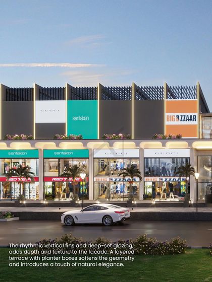 Rhythmic vertical fins and deep-set glazing add depth and texture to the facade, while planter boxes soften the geometry.