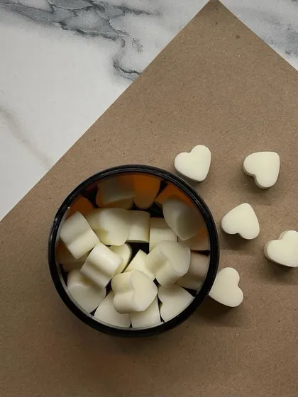 A simple, aesthetic shot of our white heart-shaped wax melts. Sometimes, simplicity is the most beautiful.