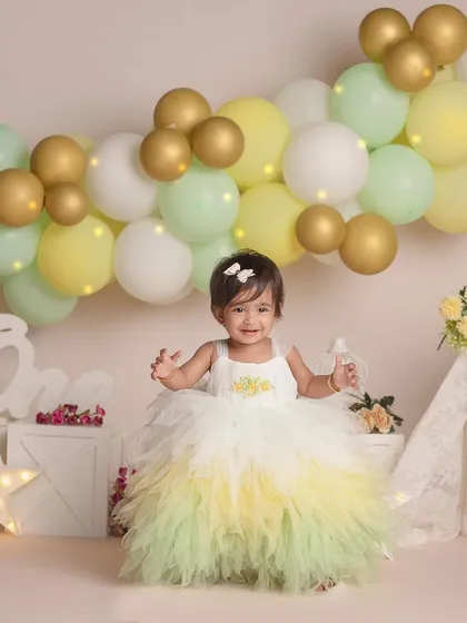 A joyful shot of the birthday girl, happy to be celebrating her special day in a beautiful setup.