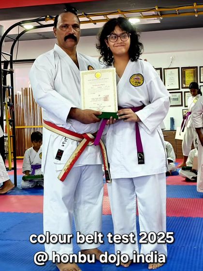 A student proudly displays her certificate after passing her colour belt test at our Honbu Dojo. These ceremonies are important events for our community, celebrating individual achievement.