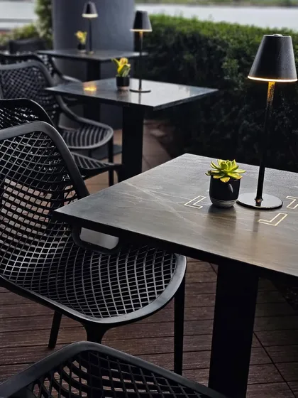 Another detail of the patio at LokalJC, showing the modern furniture and thoughtful touches that make it an inviting space to enjoy the waterfront views.