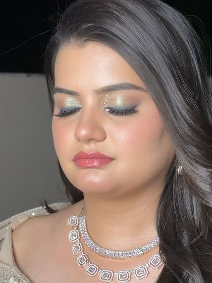A close-up of this dreamy, iridescent eye makeup. I used a mix of green and gold shimmer to create this unique and magical look for a Sangeet.