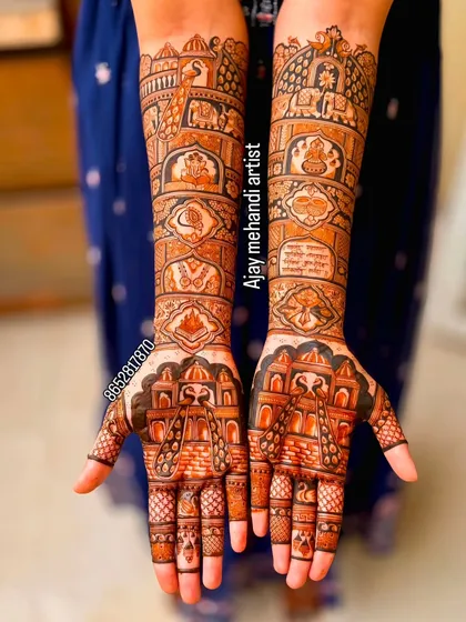 This full-coverage bridal mehndi includes various traditional elements like palace architecture, elephants, and auspicious symbols, telling a complete story on the bride's hands.
