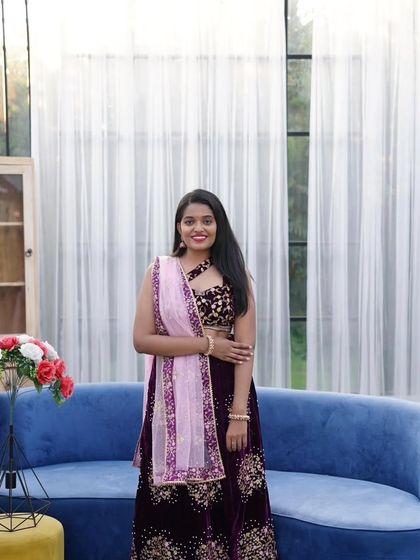 The bride-to-be looks radiant in this full-length shot of the purple lehenga. The outfit is perfect for both solo portraits and couple's photos.